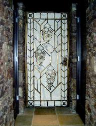 Wine cellar  Iron Door Frank Lloyd Wright inspired design Patina Faux finish (there is a white sheet behind the door for pictures sake)