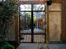 we also designed and fabricated 23 elaborate brackets that surround the upper perimeter of fence to keep the cats from climbing out