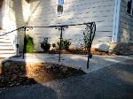 custom curved railing with decorative scrolls and elaborate lambs tongue