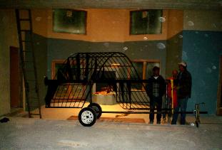 spiral staircase on transport jig  ready to be lifted up into loft one story 