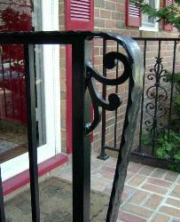 etched and hammered top rail with an elaborate lambs tongue